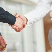 Handshake of two men. Successful business contacts after a good deal